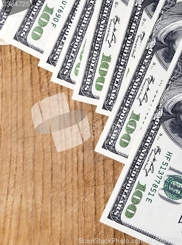Image of dollars on wood