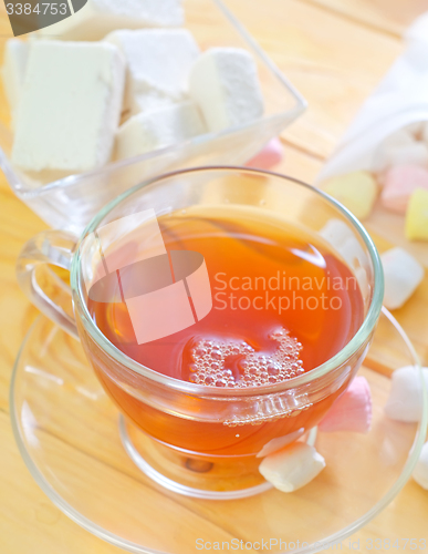 Image of Fresh tea with candy