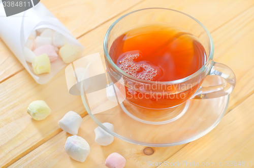 Image of Fresh tea with candy