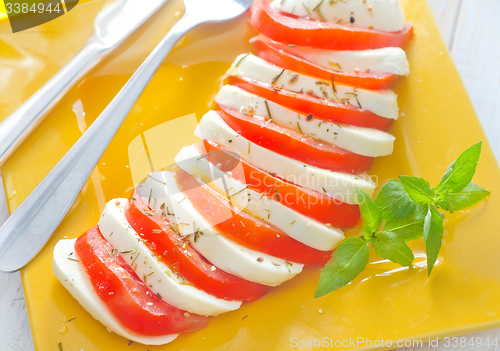 Image of caprese, fresh salad with tomato and mozzarella