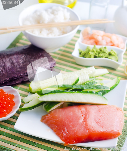 Image of ingredients for sushi, sakmon and cucumber