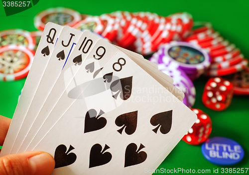 Image of Card for poker in the hand, chips and card for poker
