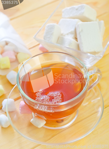 Image of Fresh tea with candy