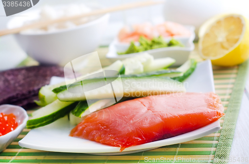 Image of ingredients for sushi, sakmon and cucumber