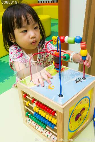 Image of Chinese girl solving puzzle