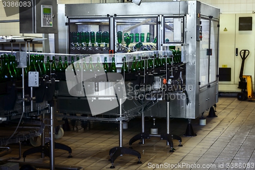 Image of Many bottles on conveyor belt