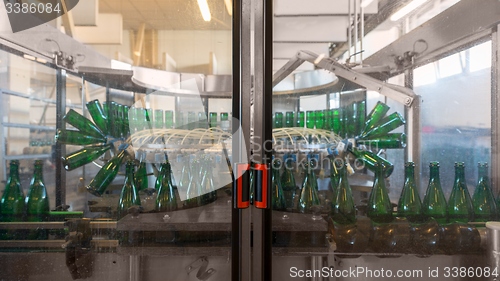 Image of Bottling machine with many bottles