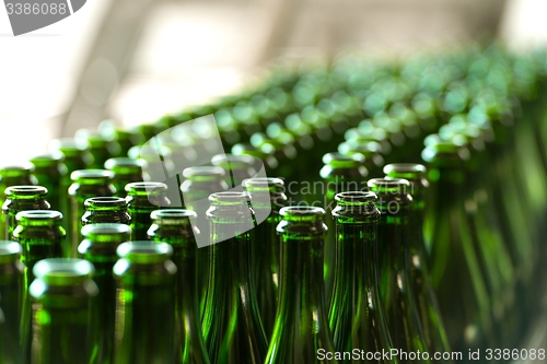 Image of Many bottles on conveyor belt