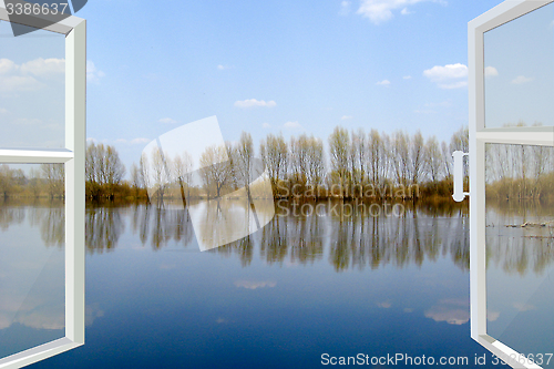 Image of opened window to the flood river