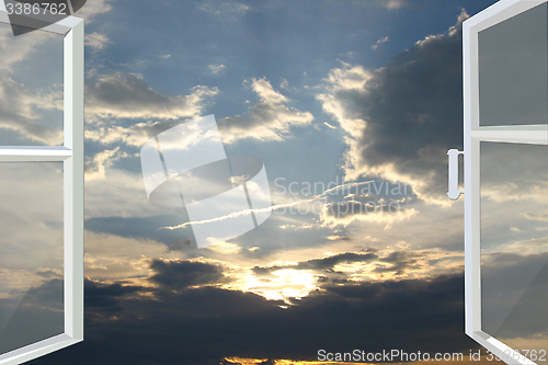 Image of window opened to the sunset