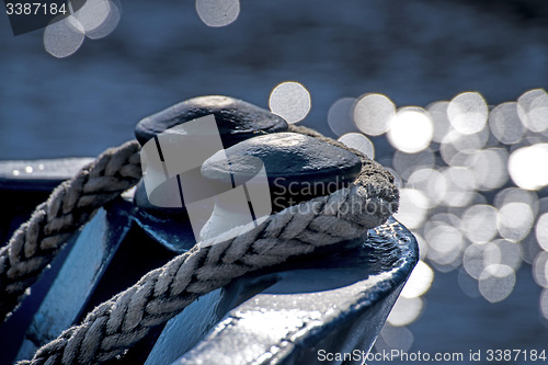 Image of ship bow in back lighting with water reflexions