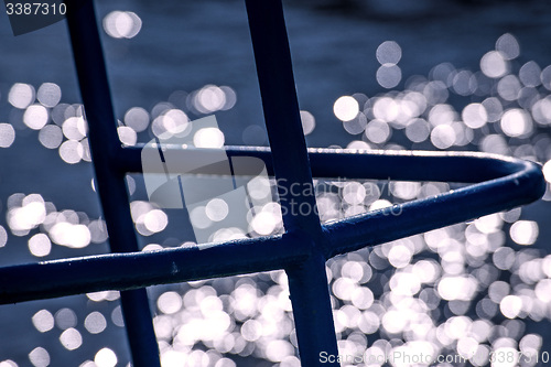 Image of ship bow in back lighting with water reflexions