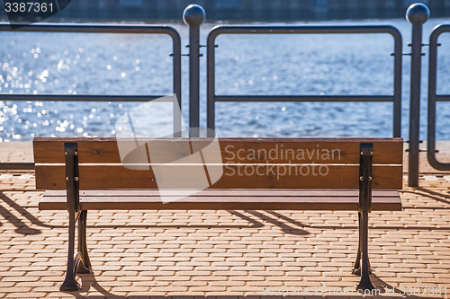 Image of park bench at a seaport