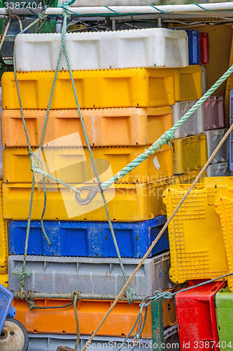 Image of Empty boxes for fish on a trawler