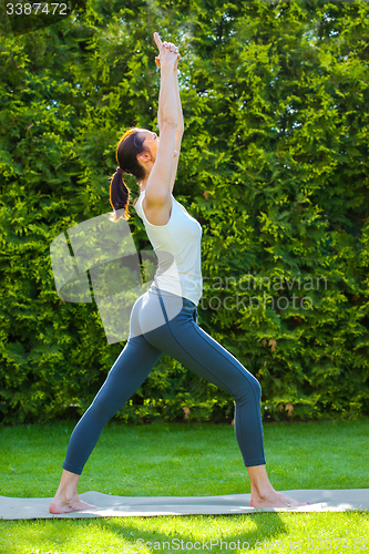 Image of beautiful woman doing yoga