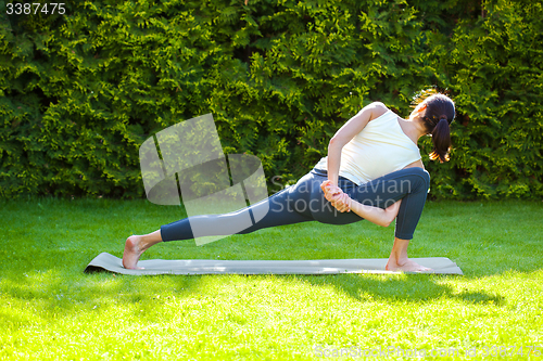 Image of woman doing yoga