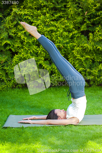 Image of pretty woman doing yoga