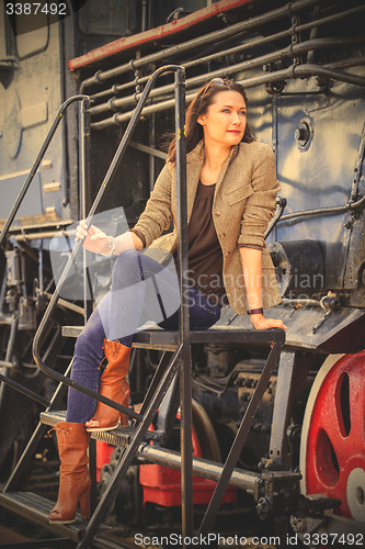 Image of retro travel fashion portrait of a beautiful adult woman