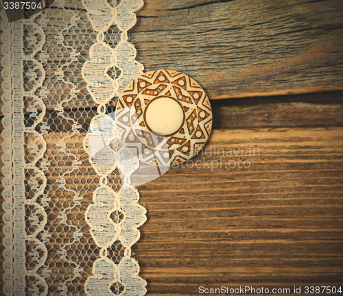 Image of vintage button and lace tape