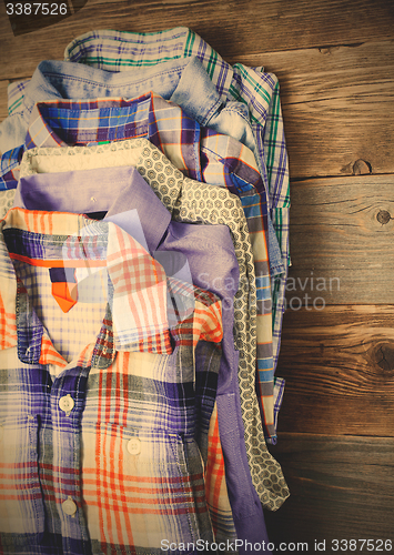 Image of bright shirts in a stack