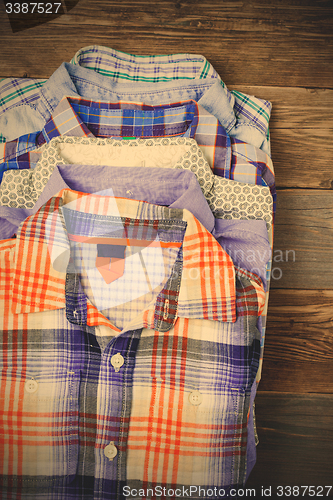 Image of stack of colored shirts