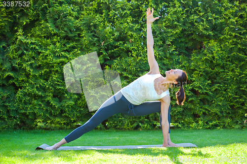 Image of beautiful woman doing yoga