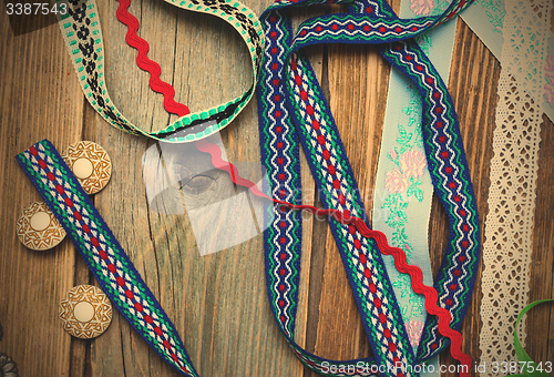 Image of lace, lribbons, tape and buttons