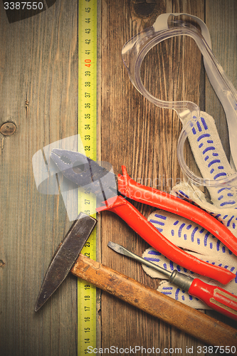 Image of vintage tool set and safety gloves and glasses