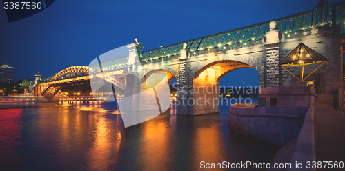 Image of night landscape with covered bridge