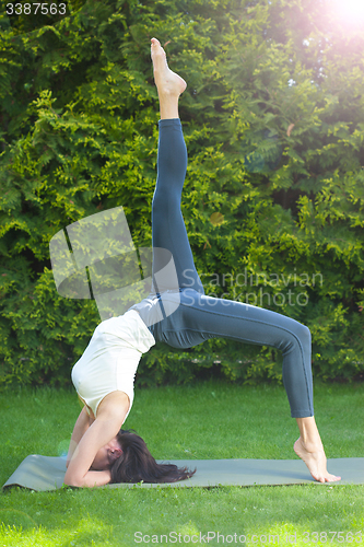 Image of beautiful woman doing yoga