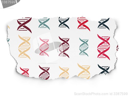 Image of Medicine concept: DNA icons on Torn Paper background