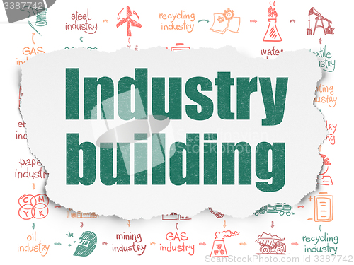 Image of Manufacuring concept: Industry Building on Torn Paper background