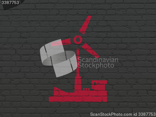 Image of Industry concept: Windmill on wall background