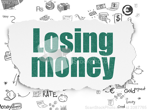 Image of Banking concept: Losing Money on Torn Paper background