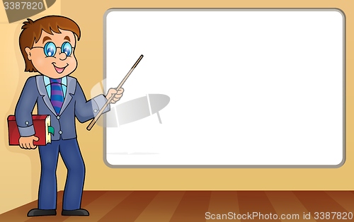 Image of Man teacher standing by whiteboard