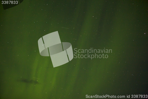 Image of Northern lights with bright stars in Iceland