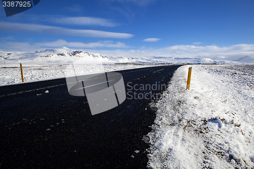 Image of Wet road with impressive landscape 