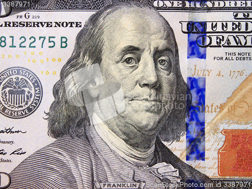 Image of hundred dollar bank note with image of president