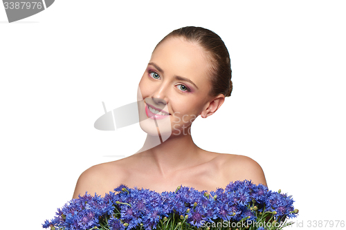 Image of Beautiful girl with pink peony flowers