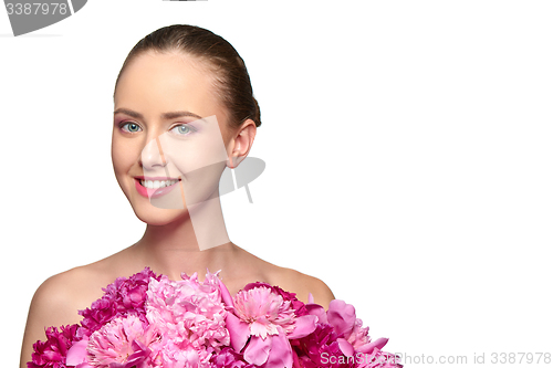 Image of Beautiful girl with pink peony flowers