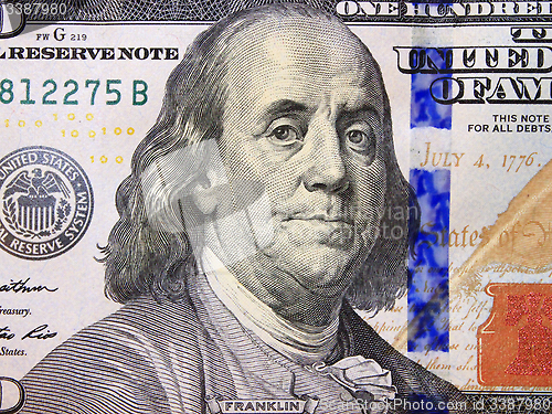 Image of hundred dollar bank note with image of president