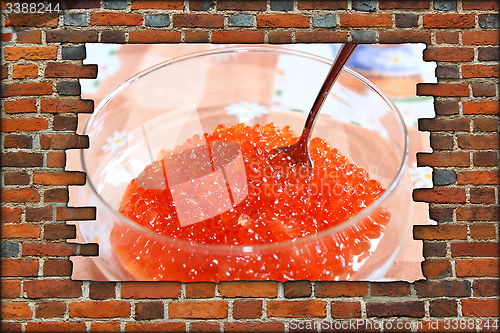 Image of signboard with broken brickwall and red caviar