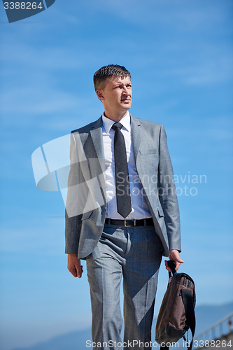 Image of senior  businessman outdoors