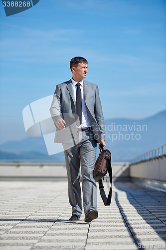 Image of senior  businessman outdoors