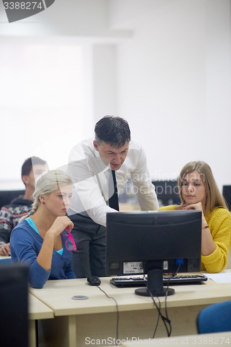 Image of students with teacher  in computer lab classrom