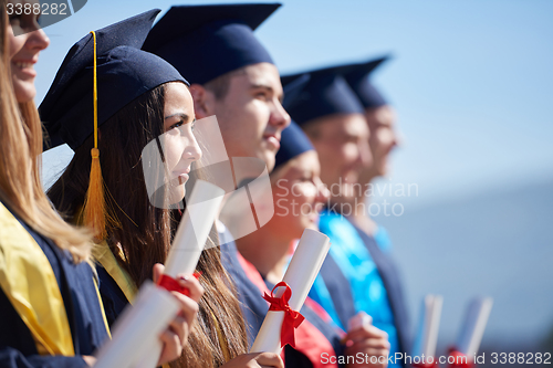 Image of young graduates students group