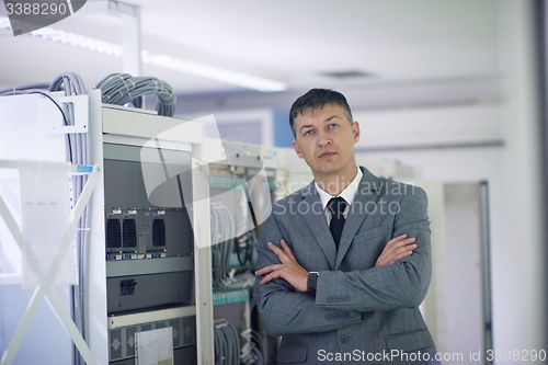 Image of network engineer working in  server room