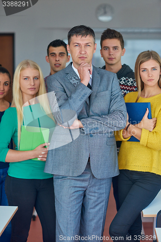 Image of group portrait of teacher with students