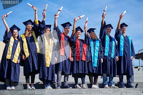 Image of young graduates students group