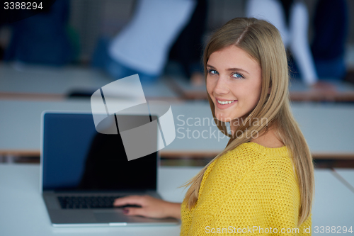 Image of portrait of happy smilling student girl at tech classroom